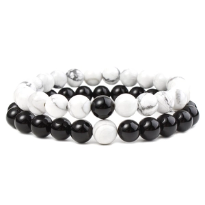 Detailed view of 8mm matte black and white turquoise beaded bracelets for couples