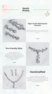 Macro shot of silver alloy floral necklace set featuring white rhinestones and craftsmanship