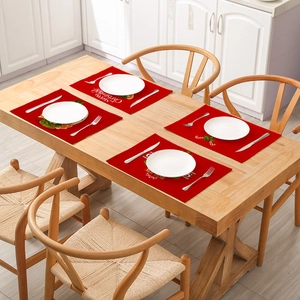Red Christmas cotton linen placemats with Merry Christmas text and festive patterns