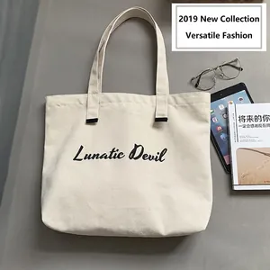 Chic canvas tote bag in off-white with Lunatic Devil print and black reinforced handles