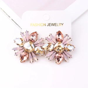 Elegant floral rhinestone drop earrings with pink and champagne crystals on display card