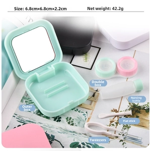 Detail view of square mint green contact lens case with tools and interior mirror