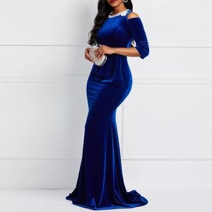 Detail of royal blue velvet off-shoulder dress featuring slim mermaid silhouette and texture