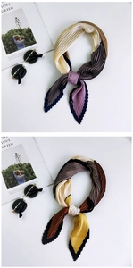 Detail view of accordion pleated silk scarf with two-tone color block textures