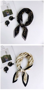Macro detail of pleated silk scarves featuring elegant golden chain patterns on fabric
