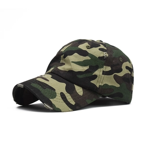 Close-up of distressed brim and jungle camouflage pattern on cotton baseball cap
