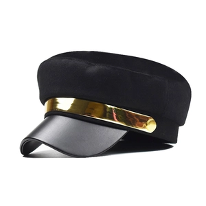 Vintage black military baker boy hat with leather brim and gold metal band accent