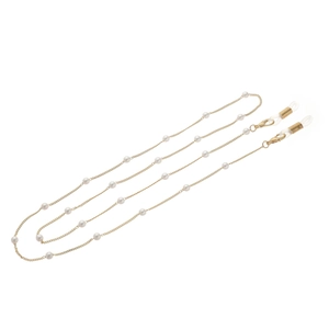 Fashionable golden glasses chain featuring white pearls and silicone ends for secure wear