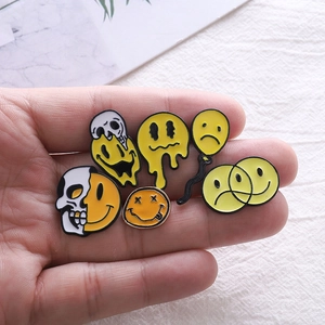 Skull and smiley face enamel pin set with melting avocado and balloon designs