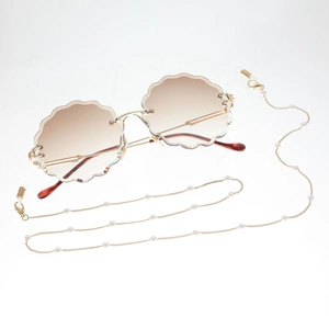 Chic frameless brown gradient sunglasses with gold pearl chain accessory for women