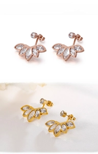 Close-up of gold and rose gold flower stud earrings with zircon marquise petals