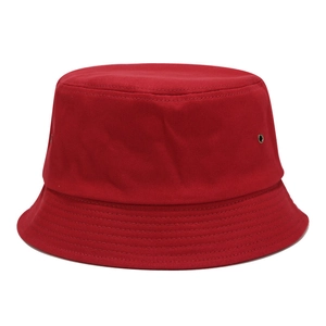 Detail of red cotton bucket hat featuring metal eyelets and reinforced brim stitching