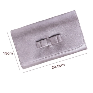 Pale purple faux leather makeup brush bag with 20.5cm width and elegant bow decoration