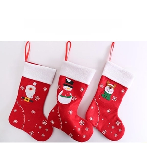 Three-piece Christmas felt stockings featuring Santa, snowman, and reindeer designs