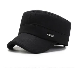 Detail view of black wool military cap featuring a silver Vashion logo on the side