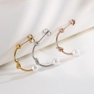 Classic C-shape knot earrings with white pearls in gold, silver, and rose gold finishes