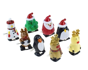 Close-up set of 8 wind-up Christmas toys including Santa, reindeer, and snowman