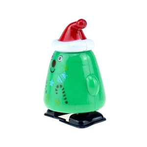Detail of green Christmas tree wind-up toy with red hat and festive patterns
