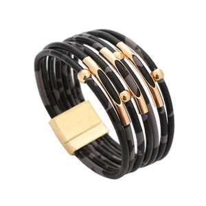 Close-up of leopard print leather wrap bracelet with gold tubes and magnetic buckle