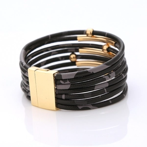 Macro detail of multi-layer leopard print bracelet with gold magnetic clasp and metal beads