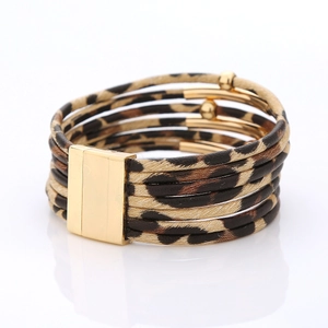 Close-up of leopard print multilayer bracelet featuring gold beads and a strong magnetic clasp