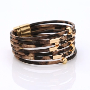 Detail of multilayer leopard print wrap bracelet with golden beads and magnetic clasp