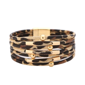 Detail view of multi-layer wrap bracelet with leopard print leather and golden magnetic clasp