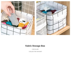 Detailed view of checkered linen fabric storage bins with handles for organizing small items