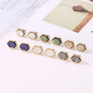 Colorful hexagonal geometric stud earrings set with sparkling resin and gold beaded edges