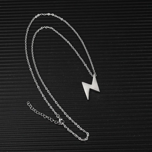 Vintage stainless steel lightning bolt pendant necklace for men and women on black surface