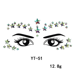 Macro shot of iridescent star-shaped face jewel stickers for party artistic decoration