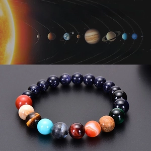 Detailed close-up of handmade solar system bracelet with colorful natural stones