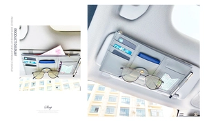 Detail of grey PU leather car visor organizer featuring card slots and a sunglasses clip