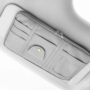 Detailed view of grey PU leather car visor organizer with card slots and mesh pocket