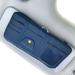 Detail of dark blue PU leather sun visor organizer showing card slots and mesh pocket