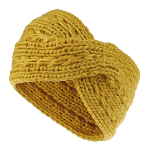Macro detail of ginger yellow chunky knit headband with a textured twist design