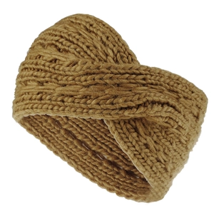 Macro shot of ginger yellow chunky knit headband with crossover twist knot texture