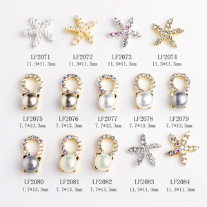 Mixed grid of metal starfish and pearl nail charms in gold and silver finishes