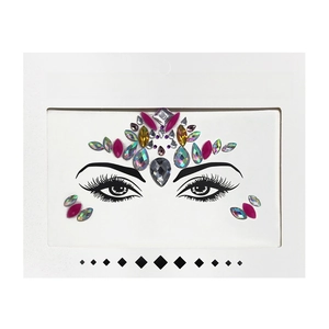 Detailed view of pink and iridescent face crystal stickers with rhinestones on white card