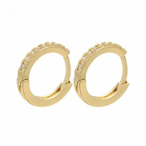 Close-up of gold-plated hoop earrings with micro-pave cubic zirconia inlay detail