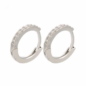 Close-up of gold-plated hoop earrings with micro-pave white cubic zirconia stones