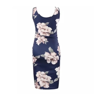 Detail of navy blue sleeveless maternity dress with pink floral print and U-neckline
