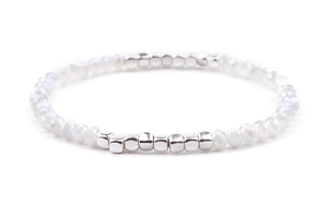 Detail view of elastic white faceted bead bracelet with silver square metallic spacers