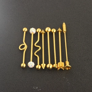 Rose gold industrial piercing set with arrow and screw barbell designs in medical steel