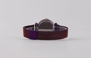 Detail view of the purple starry sky watch case back and magnetic Milanese mesh band