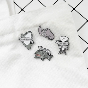Creative gray shark enamel pin set with humorous English text on white fabric