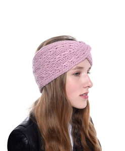 Detailed knit texture of pink chunky acrylic ear warmer with cross-knot design