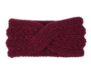Close-up of wine red chunky knit headband featuring a stylish cross twist design