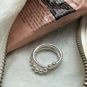 Minimalist S925 sterling silver multi-layered ring with polished beads on white pouch