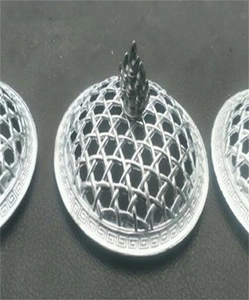 Detailed view of silver metal incense burner lids with hollow grid and flame top handle